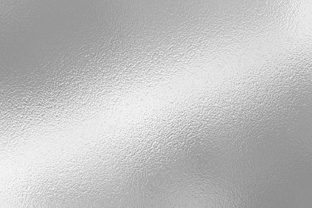 istock Gray or silver foil frosted glass effect texture background. Abstract gradient bright light reflection and shiny rough texture surface 2241942952