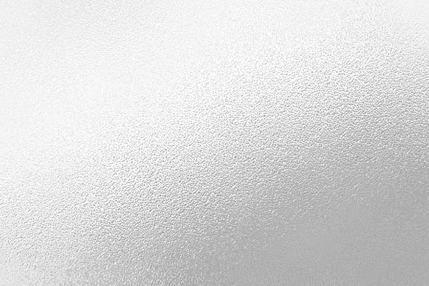 istock Gray or silver foil frosted glass effect texture background. Abstract gradient bright light reflection and shiny rough texture surface 2241942954