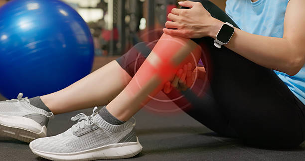 istock asian woman gym exercise suffer calf pain 2241944310