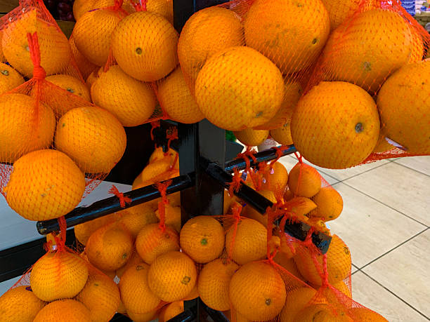 Oranges on nets display at the grocery store
