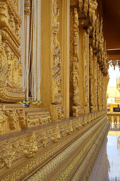 Intricate golden ceiling detail, ornate patterns and designs creating a luxurious atmosphere, suitable for elegant interiors.