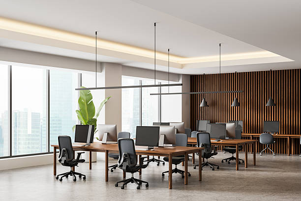 istock Modern open-plan office interior with wood accents, ergonomic chairs, and large windows in a minimalist design concept. 3D Rendering 2241951108