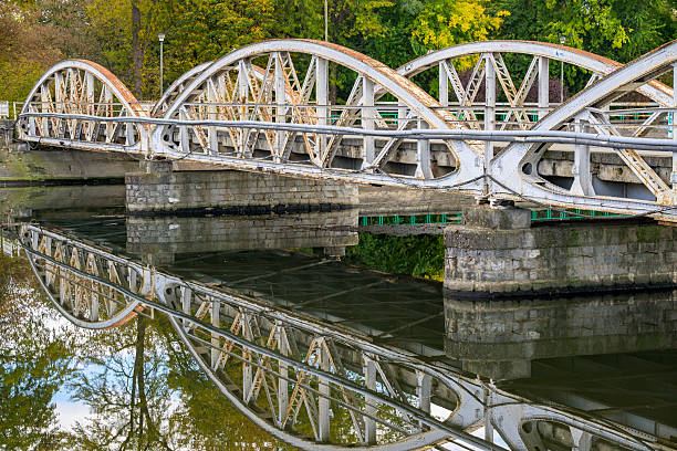 Old iron bridge over water.Reflections in the water