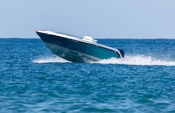 istock A small blue boat is in the water 2241955927
