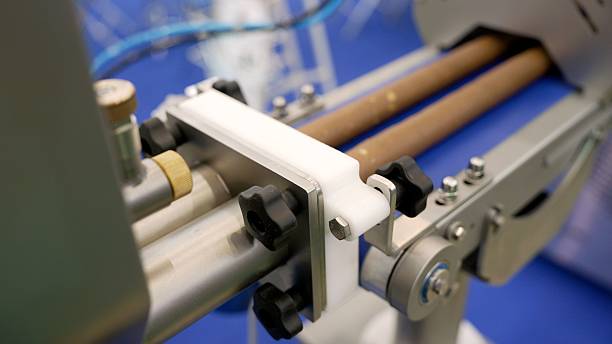 istock Industrial machine conveyor detail showing rollers and moving components 2241957229