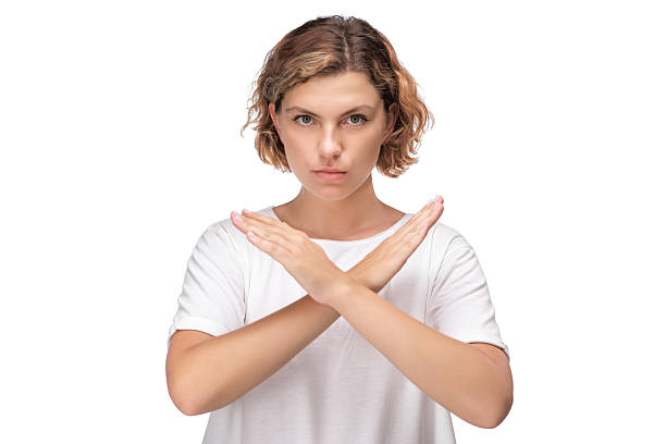 istock Serious Woman Making Crossed Arms Gesture To Express Rejection Or Stop 2241960141