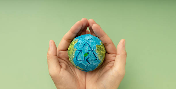 istock Earth in hands symbolizing sustainability, Recyling and Renewable 2241966464