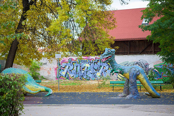 Plastic dinosaur in the park. Romania, Gorj. October, 16, 2025.