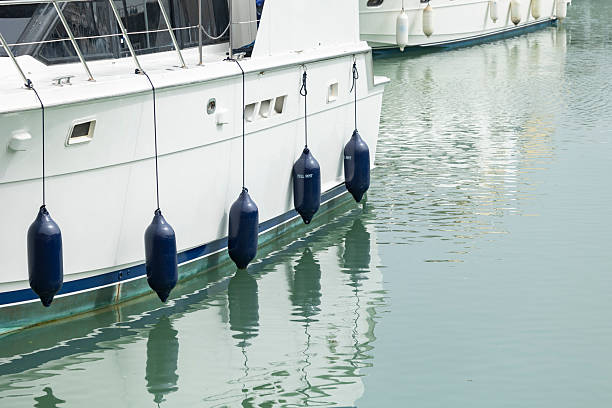istock A white luxury yacht is docked at a marina, 2241971550