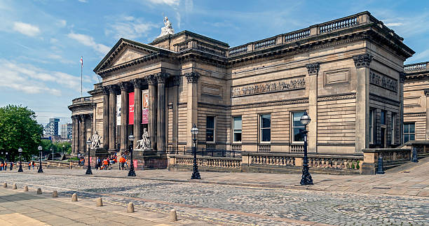 View of the Walker art gallery in the centre of Liverpool, UK.  People can be seen on the promenade