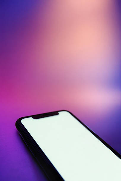 istock Vertical banner of mobile phone with bright isolated screen on neon background 2241976585
