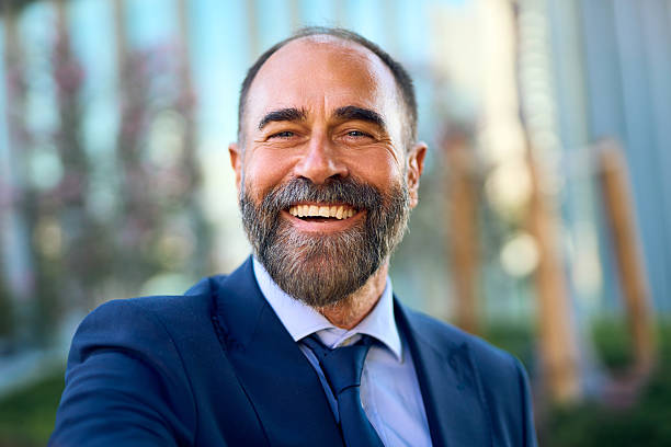 istock Mature diverse businessman smiling outside office building 2241979090