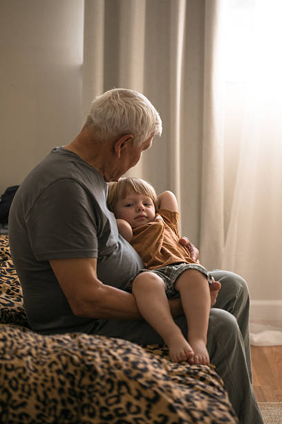 istock Portrait of Grandfather and Grandson in Soft Natural Light 2241982996
