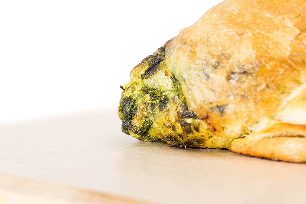 Turkish style mince and spinach stuffed filo dough borek served su boregi. Slices of pastries in the serving plate.