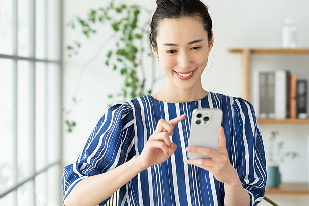 istock Young woman using a smartphone 2241986132