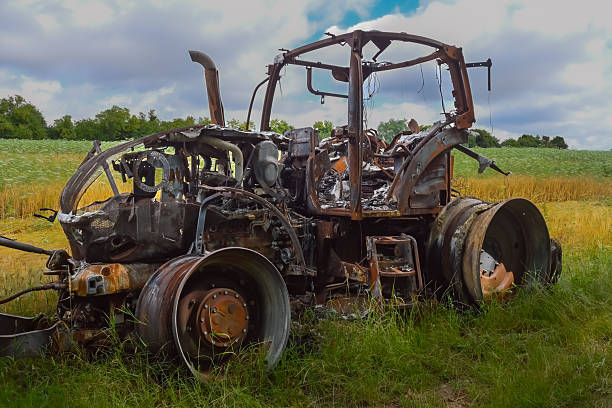 istock Image of a completely burned out tractor 2241986243