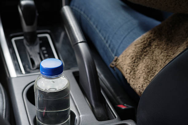 istock Drinking water in the car prepared for traveling 2241987765