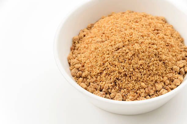 istock Powdered brown sugar in white bowl 2241989473