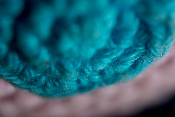 Woman holding woollen yarn balls. Hand made.