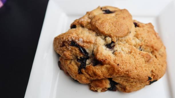 istock homemade baked blueberry cheese scone on a white plate with copy space 2241994259
