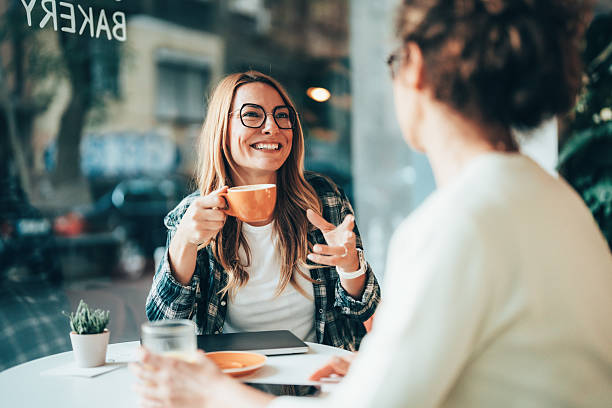 istock Friends discussing ideas over coffee 2241999371