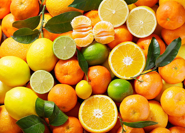 istock mix of fresh citrus fruits as background, top view 2242000697
