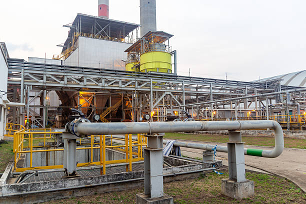 istock Industrial plant shows complex piping systems and steel structure at dusk for energy production 2242000937