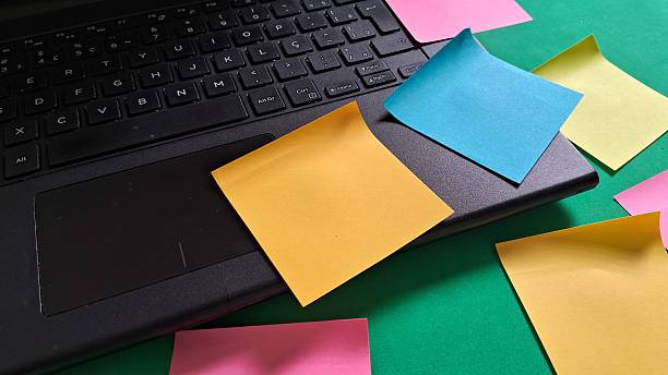istock Colorful Sticky Notes on a Laptop for Organization and Reminders 2242001604