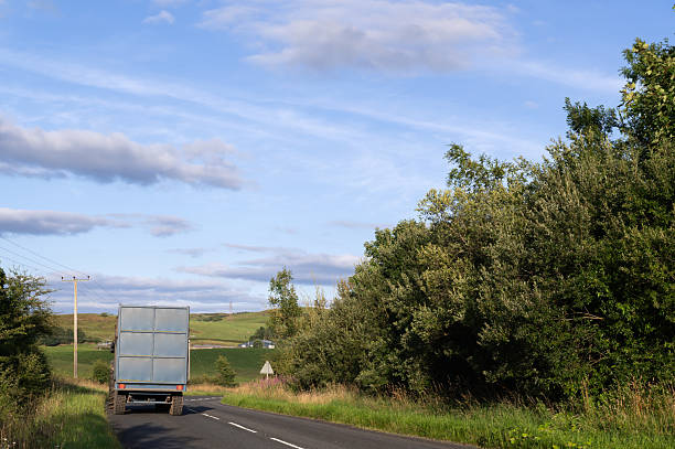 istock Tractor and trailer on a rural road in Scotland 2242004605