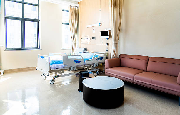 istock Modern hospital ward with bed and sofa 2242004609