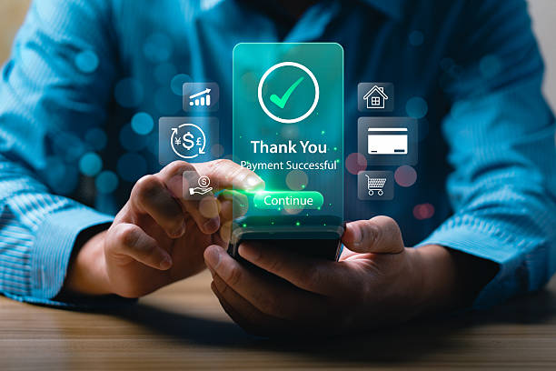 istock Businessman using smartphone for online payment confirmation with digital banking app interface showing Payment Successful message, fintech innovation, secure transaction, mobile financial technology 2242005326