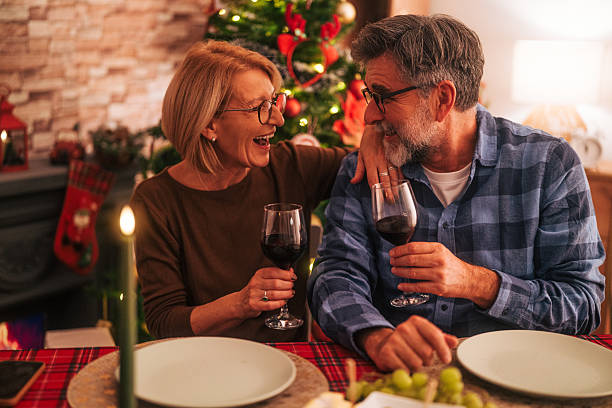 istock Senior couple sharing happy moments at christmas dinner 2242006677