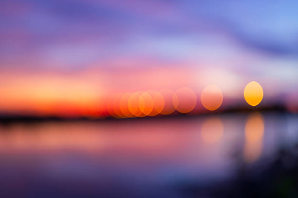 Pink sky background with blurred focus,Blurred sunset background with soft pink, orange, and purple gradients. Perfect for design projects, wallpapers, or tranquil backdrops.