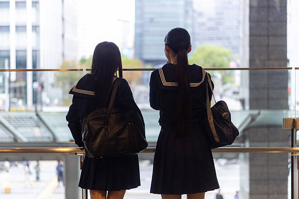 Rear view of high school girls looking at view from observatory