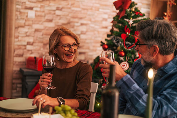 istock Senior couple sharing a joyful christmas dinner celebration 2242011328
