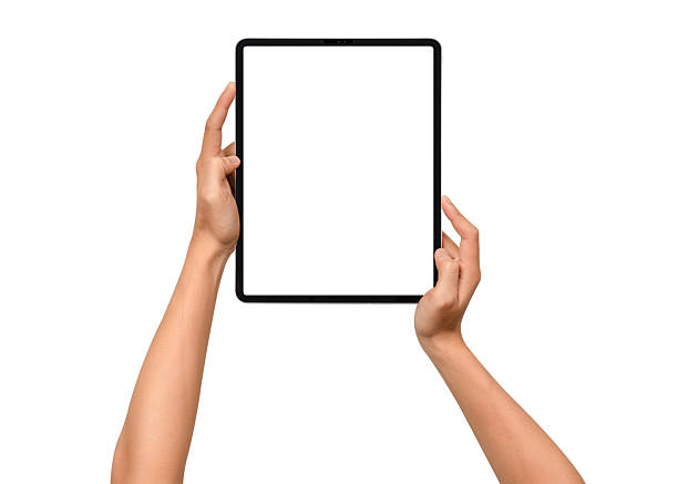 istock Close-up of hands holding a modern tablet with blank screen isolated on white background. High quality studio shot. Concept for technology, business, finance, advertising and public relations. 2242017564