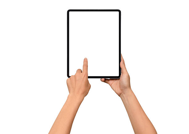 istock Close-up of hands holding a modern tablet with blank screen isolated on white background. High quality studio shot. Concept for technology, business, finance, advertising and public relations. 2242017570