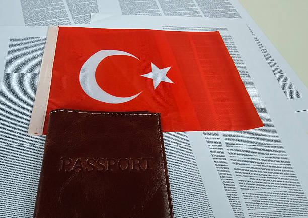 istock Turkish flag and passport placed on a newspaper background 2242017821