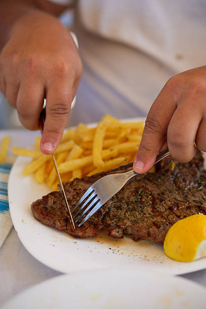 Eating Beef Steak stock photo