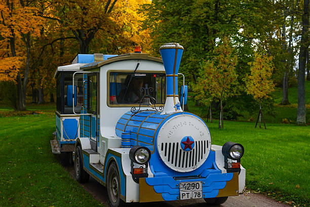 Russia, Peterhof, St. Petersburg - October 11, 2025: Charming Tourist Train in a Colorful Autumn Park