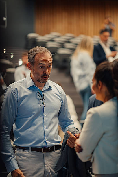 istock Business colleagues networking at conference event 2242026188