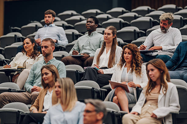 istock Diverse business people attending seminar and taking notes 2242026251