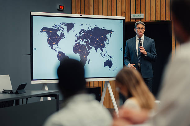 istock Business speaker presenting global network strategy to audience 2242027436