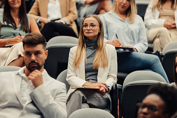 istock Business professionals listening and learning at conference seminar 2242027490