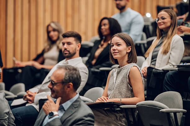 istock Diverse group of people attending business conference 2242027519