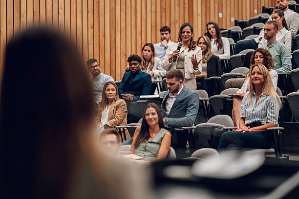 istock Audience member asking question tijdens conference 2242027566