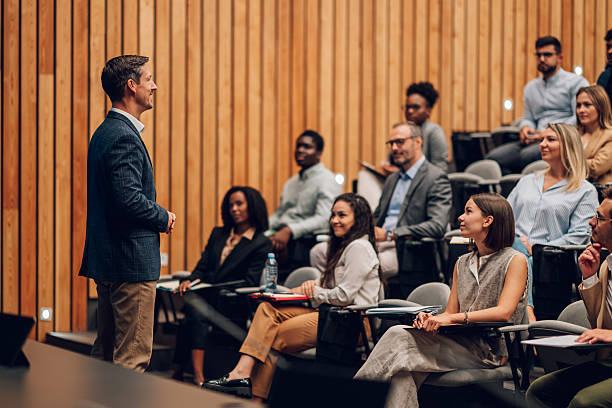 istock Speaker presenting to diverse audience at conference 2242027603
