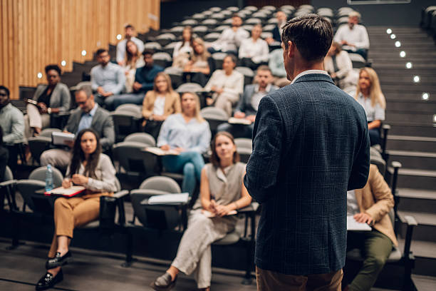 istock Speaker presenting to audience during business conference 2242027611
