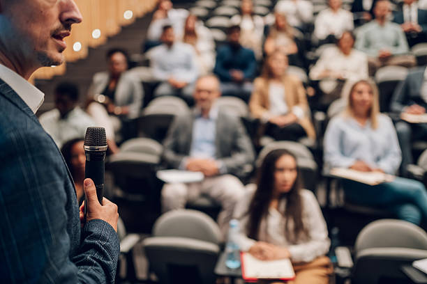 istock Speaker talking to audience at business conference 2242027647