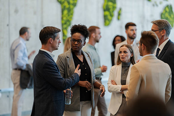 Business professionals networking at corporate conference event